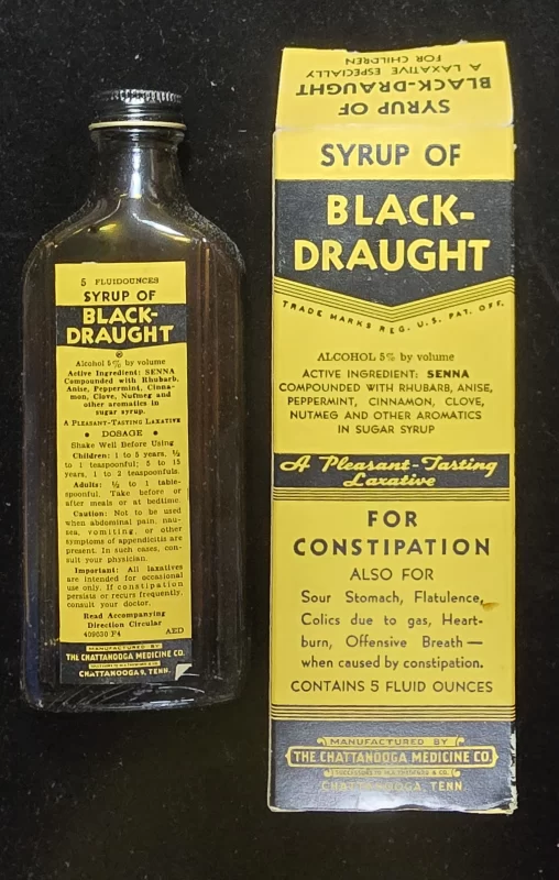 Vintage box of Thedford’s Black Draught laxative, marketed as a “family medicine” with handwritten label visible on front panel.