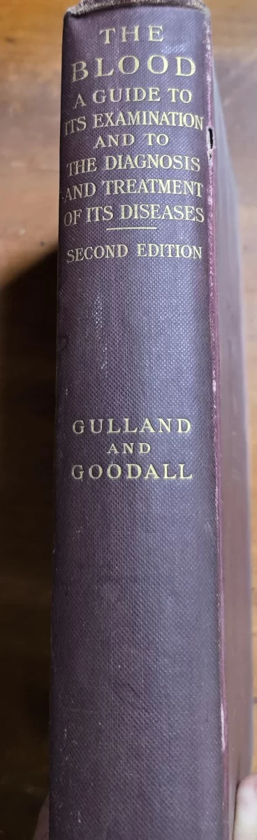 Spine view of The Blood: A Guide to Its Examination (1914), vintage hematology book with handwritten owner annotations