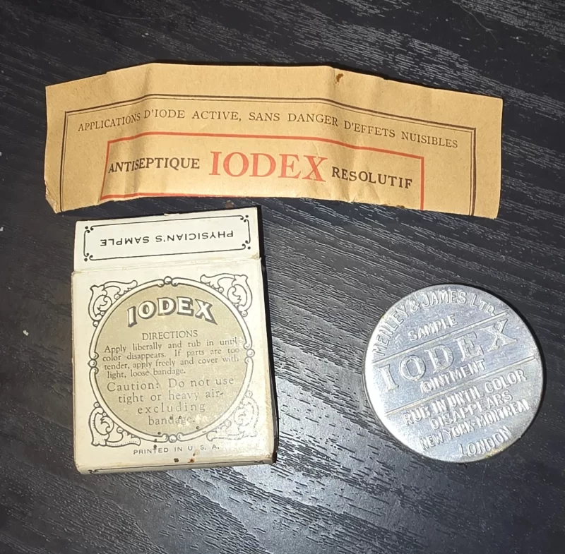 Antique Iodex ointment sample box with embossed tin and vintage packaging.