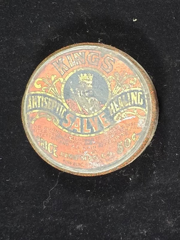 Front label of King’s Antiseptic Healing Salve tin featuring crowned king and product description