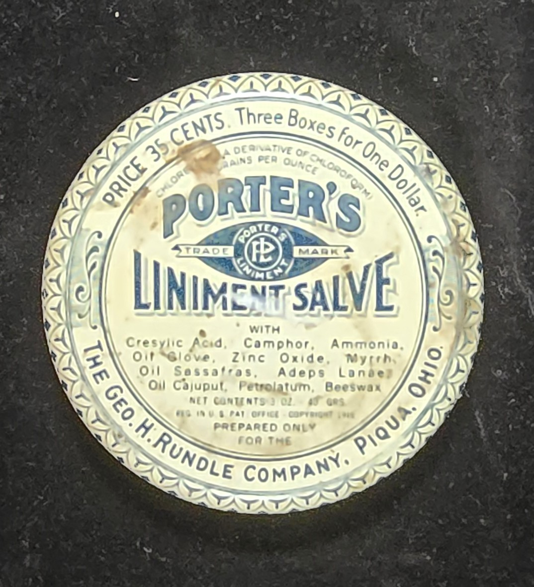 Porter's Liniment Salve tin top view showing ingredients and branding.