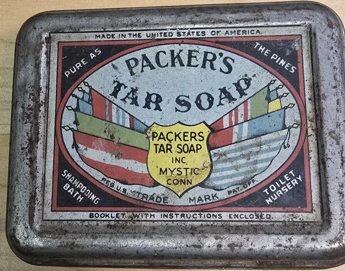 Vintage tin of Packer’s Tar Soap with multi-color ship flags and “Pure as the Pines” slogan