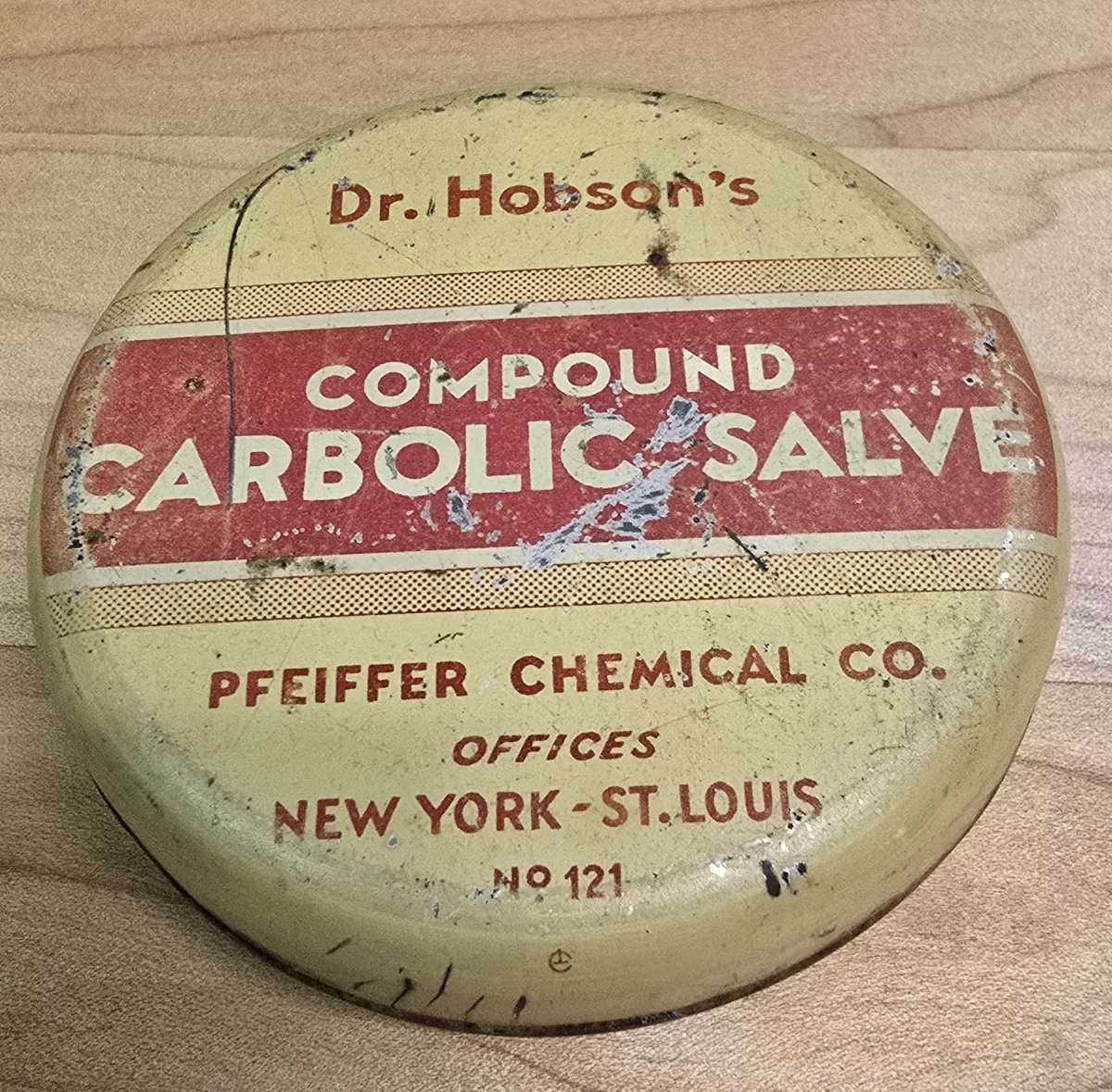 Vintage tin of Dr. Hobson’s Compound Carbolic Salve by Pfeiffer Chemical Co., labeled for cuts, burns, sunburn, and rectal use.