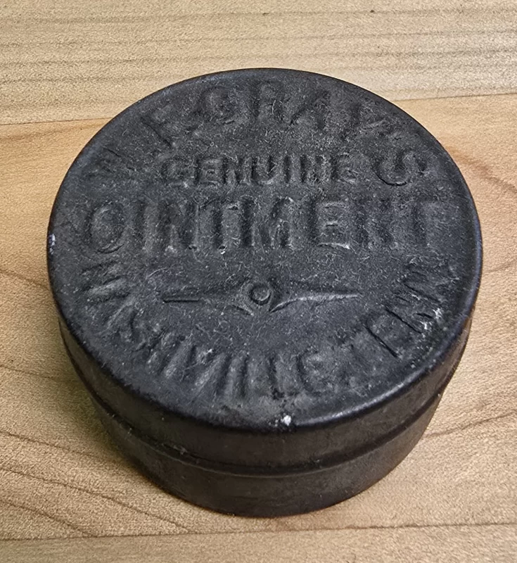 Embossed metal tin of W.E. Gray’s Genuine Ointment, Nashville, Tennessee – antique pharmaceutical salve container.