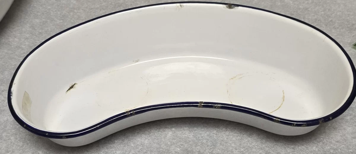 Top view of vintage white enamel emesis basin