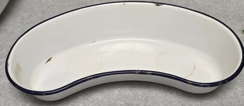 Top view of vintage white enamel emesis basin