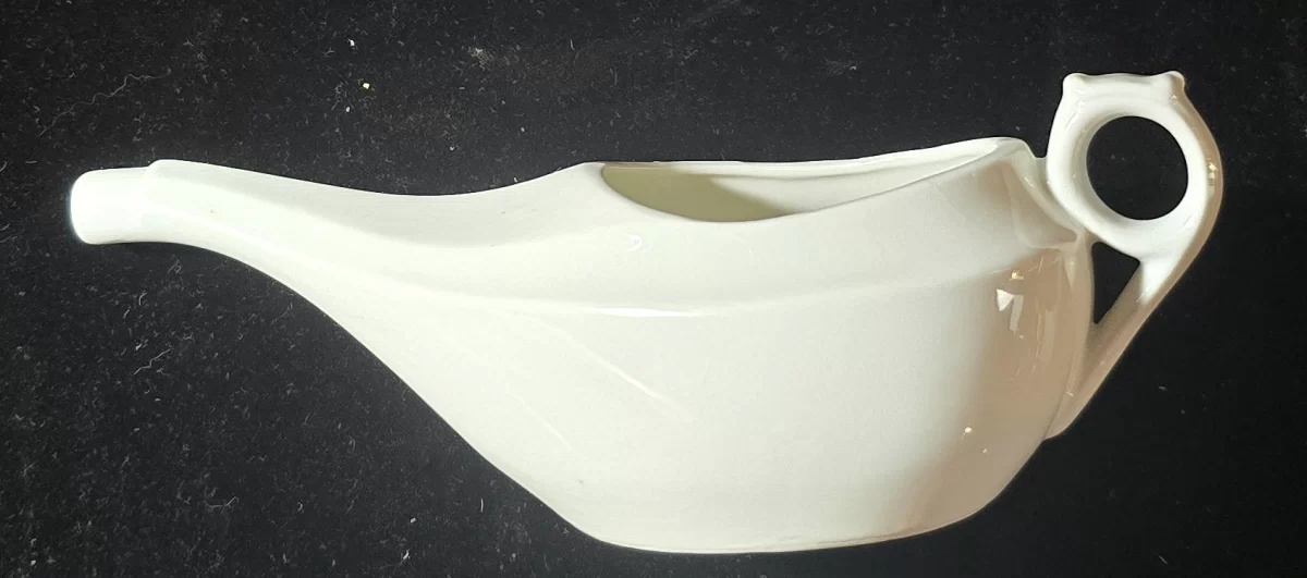 Ceramic neti pot marked WT & C Made in Germany, shown from top, side, and base views