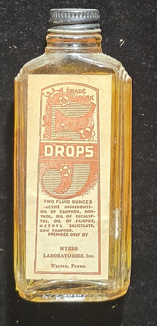 Front view of vintage 5-Drops bottle with label