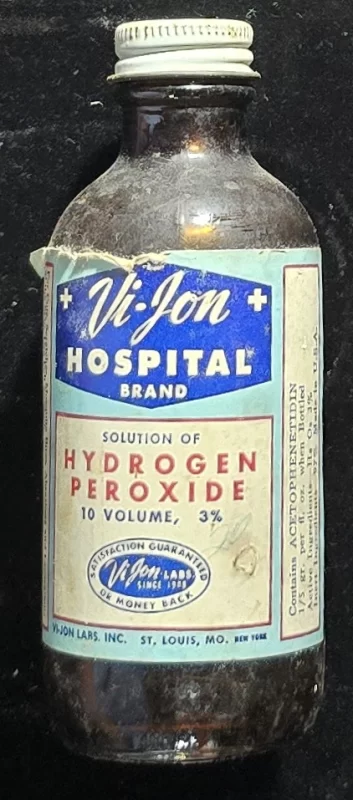 Vintage Vi-Jon hydrogen peroxide bottle with label listing acetophenetidin