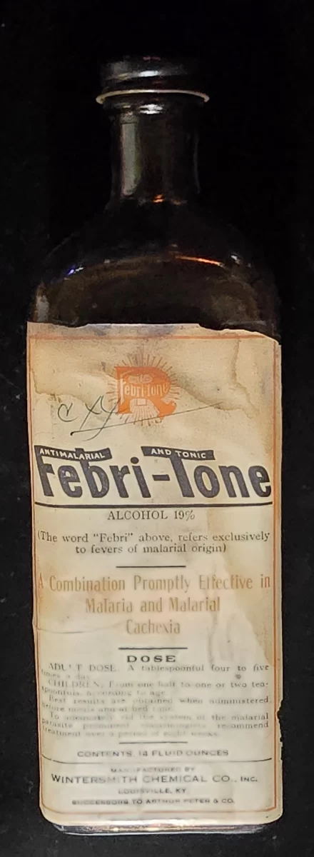 Vintage bottle labeled “Febri-Tone Antimalarial and Tonic,” produced by Wintersmith Chemical Co., Louisville, KY. Label claims effectiveness against malaria and malarial cachexia, with 19% alcohol content.