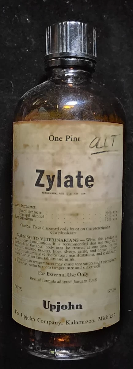Vintage amber glass bottle of Zylate by Upjohn, labeled for veterinary use only, dated with 1948 revised formula
