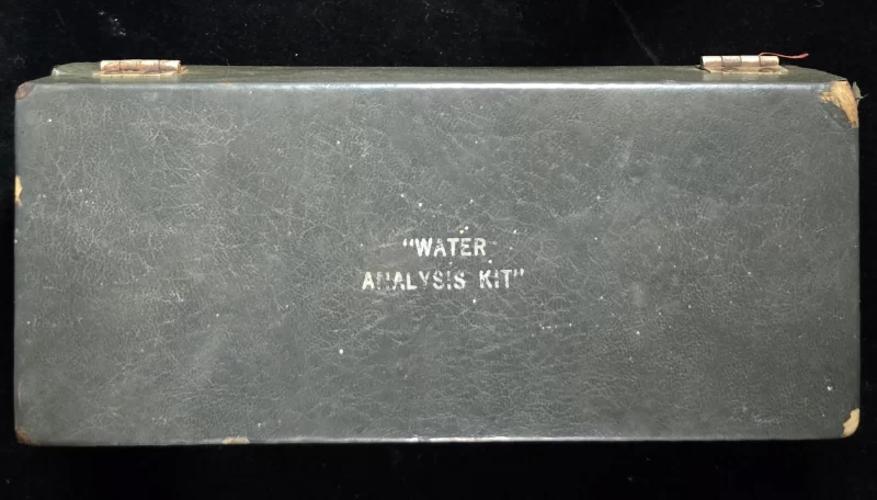 Closed vintage field case labeled "Water Analysis Kit"