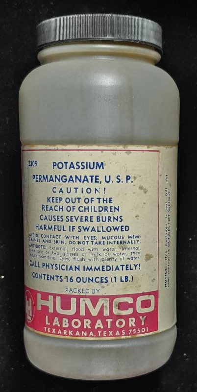 Vintage HUMCO bottle labeled Potassium Permanganate U.S.P. with caution warnings from Texarkana, Texas