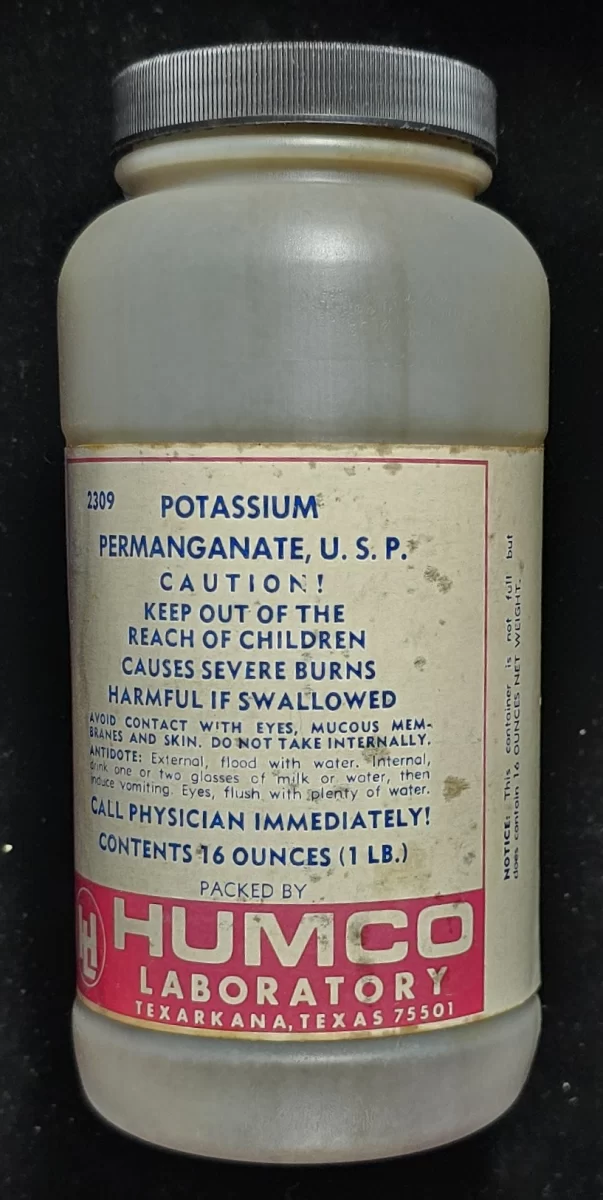 Vintage HUMCO bottle labeled Potassium Permanganate U.S.P. with caution warnings from Texarkana, Texas