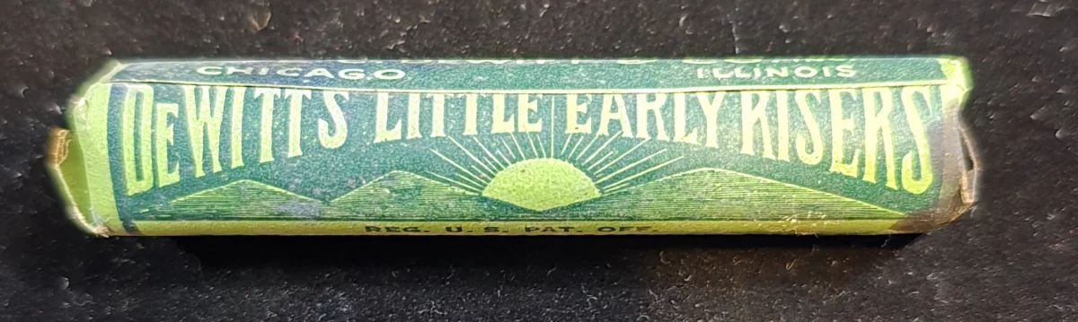 Vintage DeWitt’s Little Early Risers pill tube with sunrise logo and bold cathartic claims