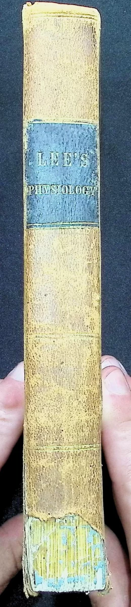 1846 leather-bound textbook titled Human Physiology by Charles A. Lee, featuring anatomical diagrams and early American science education