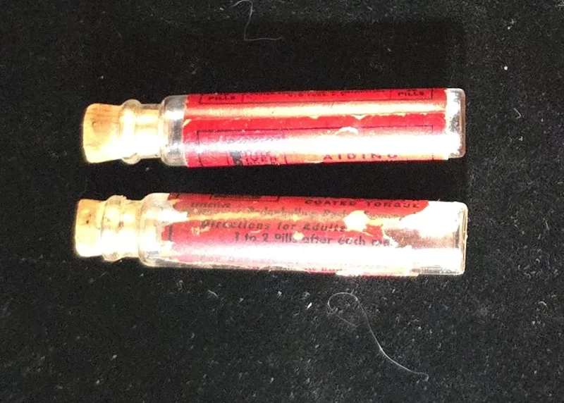 Vintage Carter’s Little Liver Pills vial showing red label with instructions and warnings.