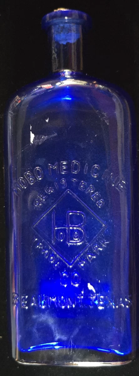 Front view of cobalt blue glass bottle embossed “HOBO MEDICINE CO. BEAUMONT TEXAS,” early 1900s patent medicine.