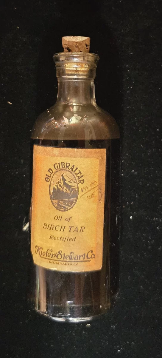 Front view of Old Gibraltar Oil of Birch Tar bottle with cork and vintage label.