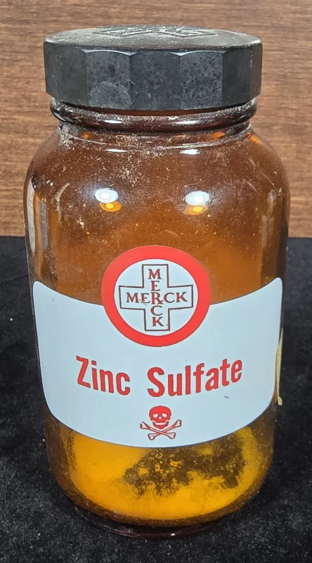 "Front view of vintage Merck zinc sulfate bottle with poison label"