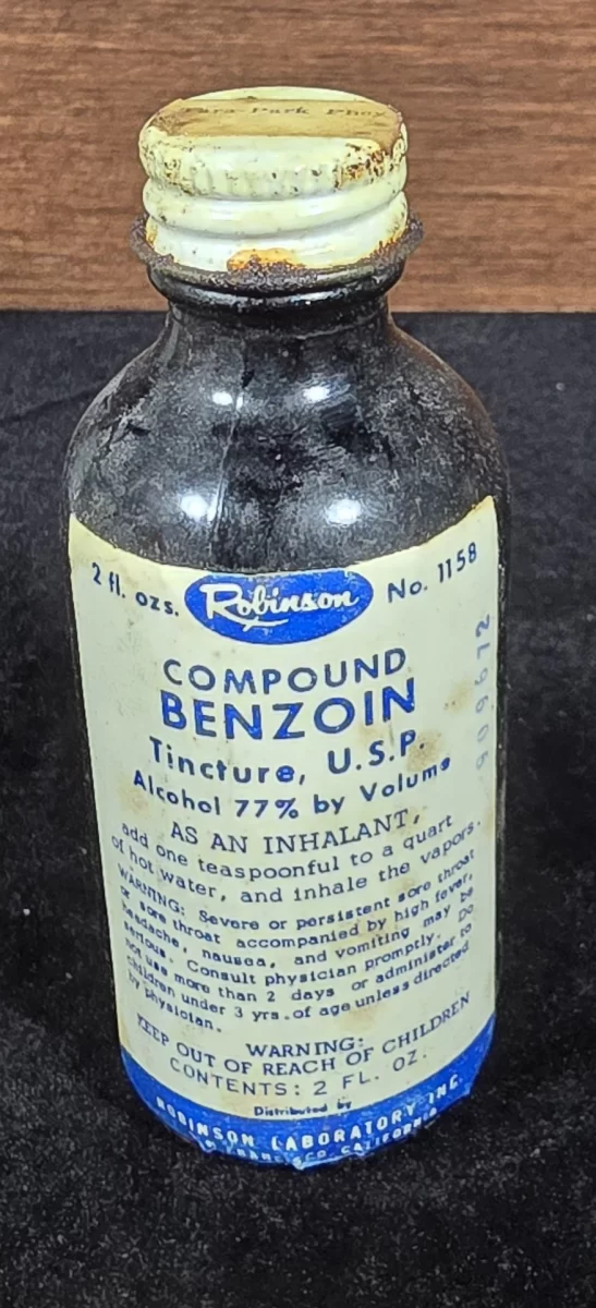 Vintage Compound Benzoin Tincture bottle labeled 77% alcohol, distributed by Robinson Laboratories