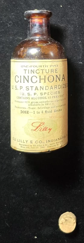 Tincture of Cinchona bottle from Eli Lilly & Co., representing historic quinine-based treatments for malaria and fevers.
