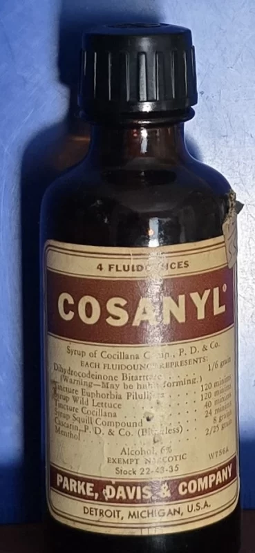 Cosanyl cough syrup bottle representing antique cough, cold, and throat remedies.