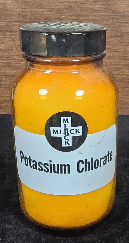 Vintage Merck potassium chlorate amber glass bottle with label.