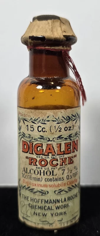 Amber glass Digalen Roche bottle with label showing dosage and Hoffmann-La Roche branding.
