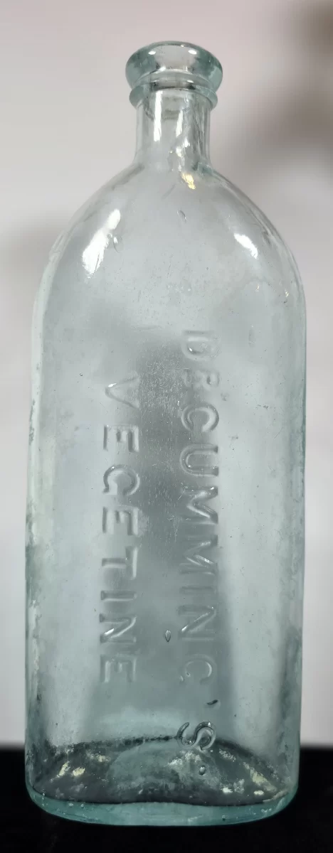 Antique aqua glass Dr. Cumming’s Vegetine bottle front view