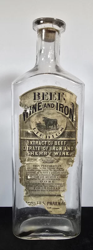 Antique clear glass bottle labeled “Beef, Wine and Iron – Liebig’s Extract of Beef, Citrate of Iron, and Sherry Wine.”