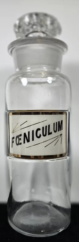 Clear glass Foeniculum apothecary jar with gold-edged label,