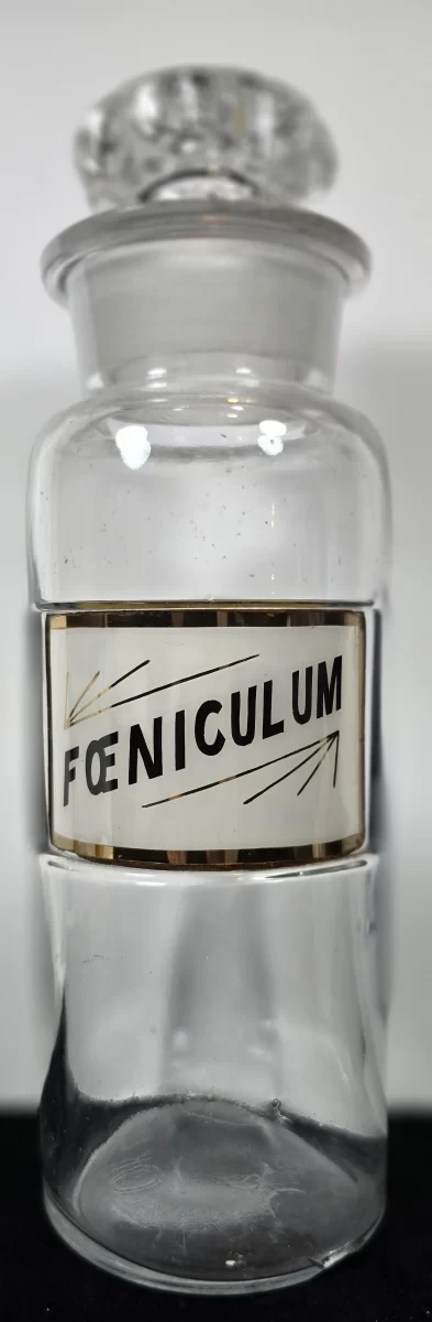 Clear glass Foeniculum apothecary jar with gold-edged label,