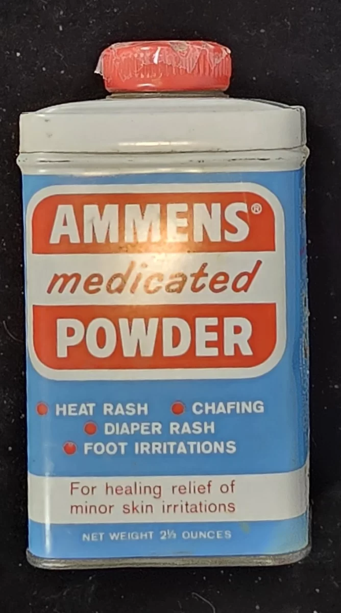 Vintage Ammens Medicated Powder tin with red cap and blue label reading “For healing relief of minor skin irritations.”