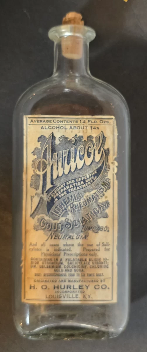 Vintage Auricol pain and gout remedy bottle from H.O. Hurley Co., Louisville, Kentucky, labeled for rheumatism, gout, sciatica, and neuralgia.