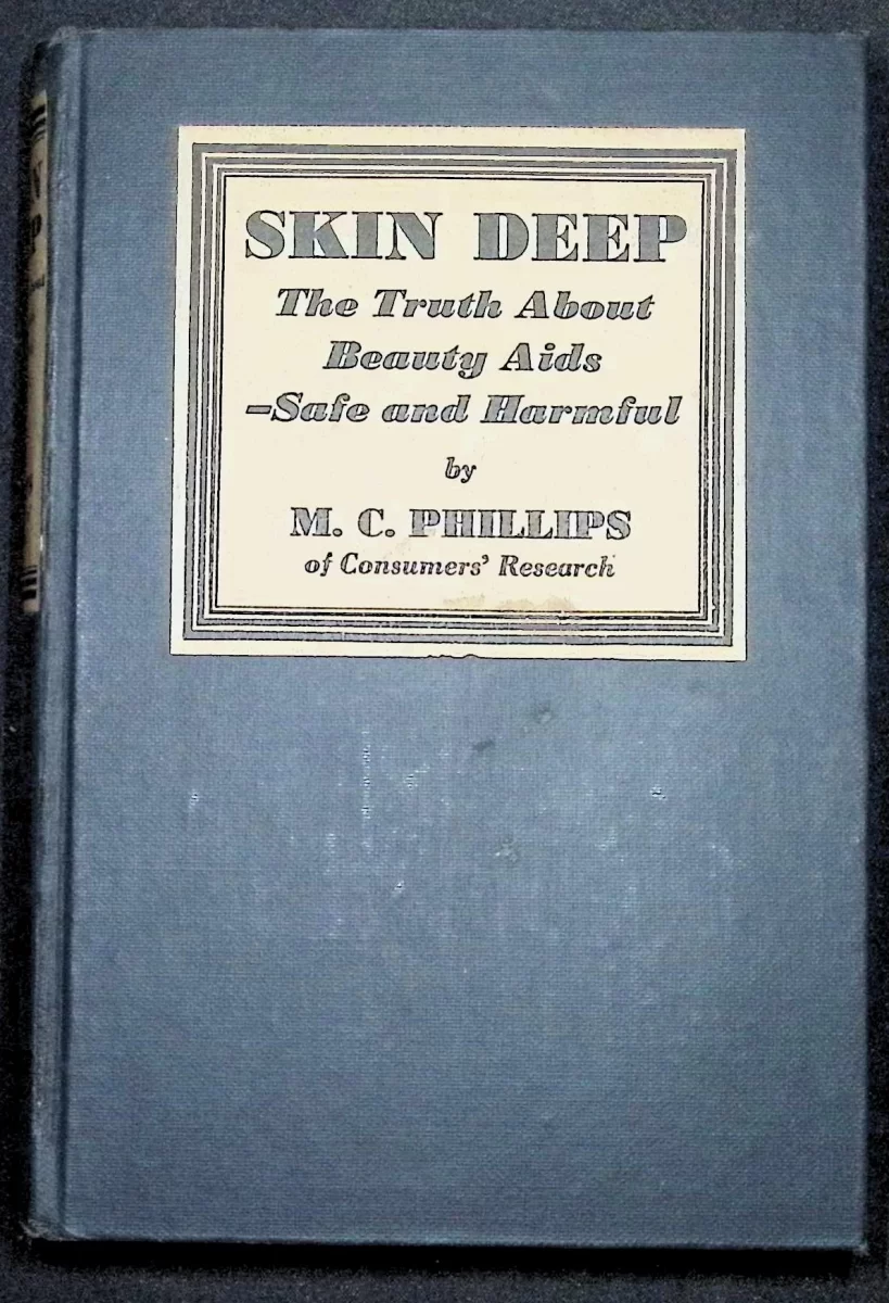 Hardcover copy of Skin Deep: The Truth About Beauty Aids — Safe and Harmful by M.C. Phillips (1934), blue cloth with printed label, published by The Vanguard Press.