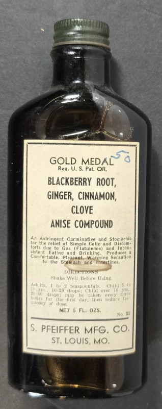 Amber paneled pharmaceutical bottle labeled “Gold Medal Blackberry Root, Ginger, Cinnamon, Clove, Anise Compound,” S. Pfeiffer Mfg. Co., St. Louis, Missouri.