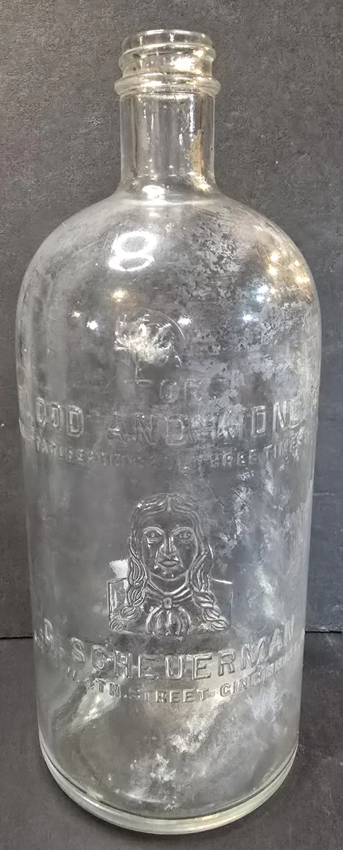 Clear embossed antique R. Scheuerman Blood and Kidney Remedy bottle with portrait and Cincinnati address.