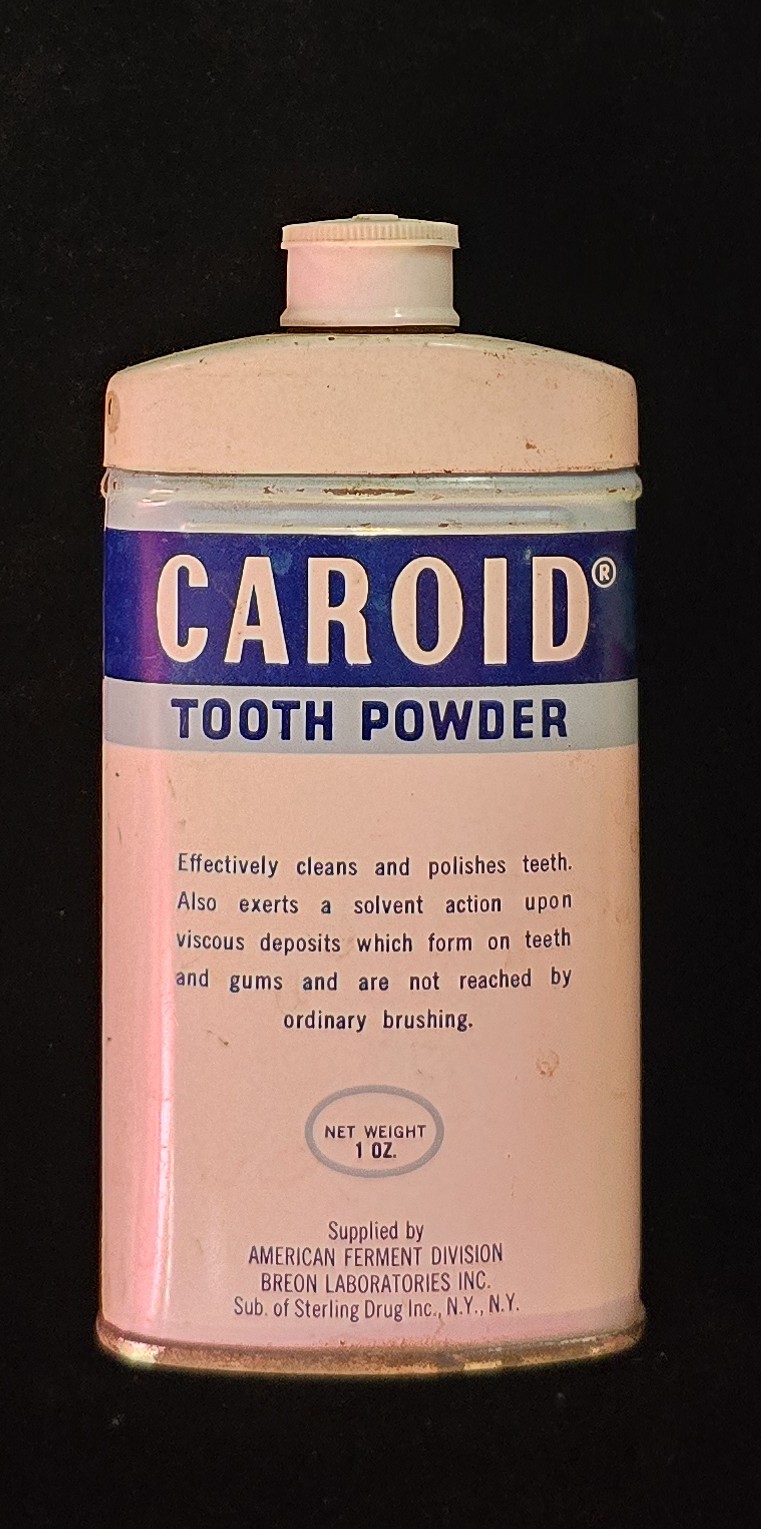 Vintage Caroid Tooth Powder bottle with enzymatic dental instructions and intact label