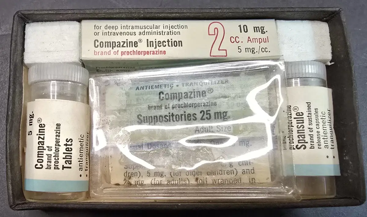 Vintage Compazine pharmaceutical kit containing injectable ampules, tablets, Spansule capsules, and adult and pediatric suppositories by Smith Kline & French Laboratories.