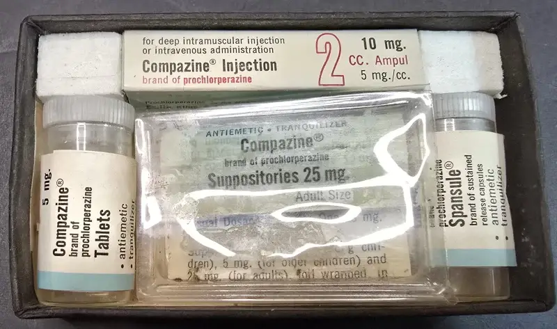 Vintage Compazine pharmaceutical kit containing injectable ampules, tablets, Spansule capsules, and adult and pediatric suppositories by Smith Kline & French Laboratories.