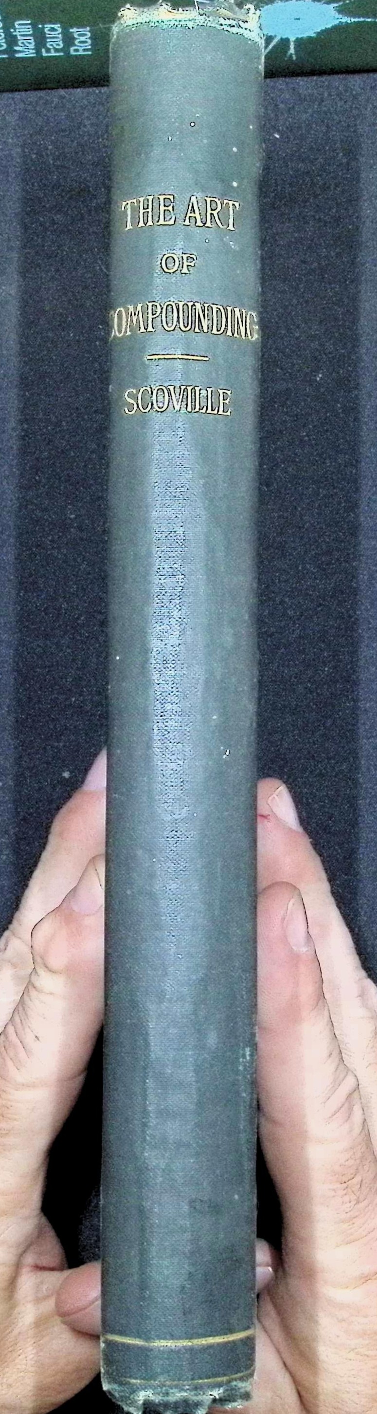 Spine and interior pages of The Art of Compounding (1897) by Wilbur L. Scoville, showing original binding, title page, and chapters on emulsions and lozenges.