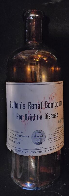 Amber glass bottle of Fulton’s Renal Compound for Bright’s Disease with original printed label and dosage instructions