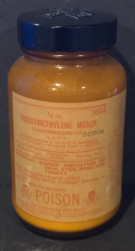 Merck paraformaldehyde laboratory reagent bottle with poison label