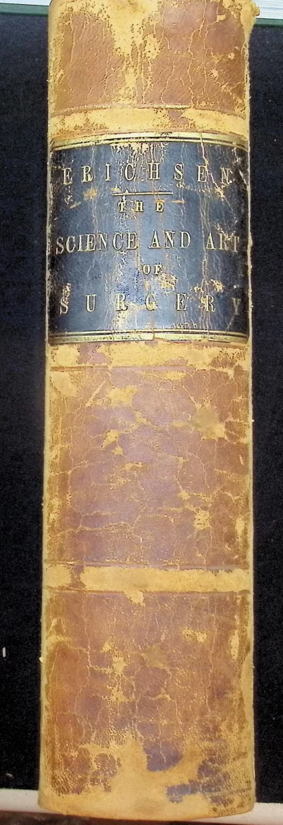 Spine of 1866 John Erichsen The Science and Art of Surgery in worn brown leather binding