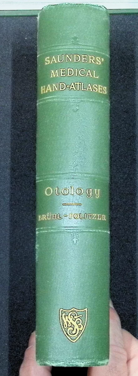 1903 Atlas and Epitome of Otology by Brühl and Politzer showing green cloth spine and detailed anatomical ear illustrations