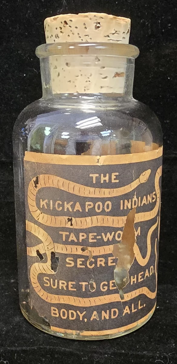 Antique Kickapoo Indians Tape-Worm Secret medicine bottle with paper label and cork stopper