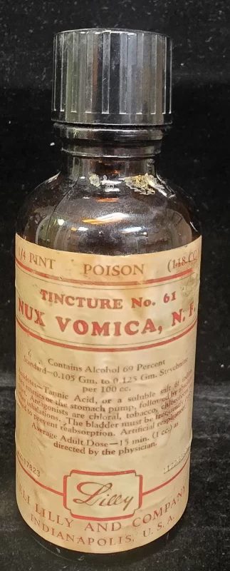Eli Lilly Tincture of Nux Vomica poison bottle with strychnine label and antidote instructions