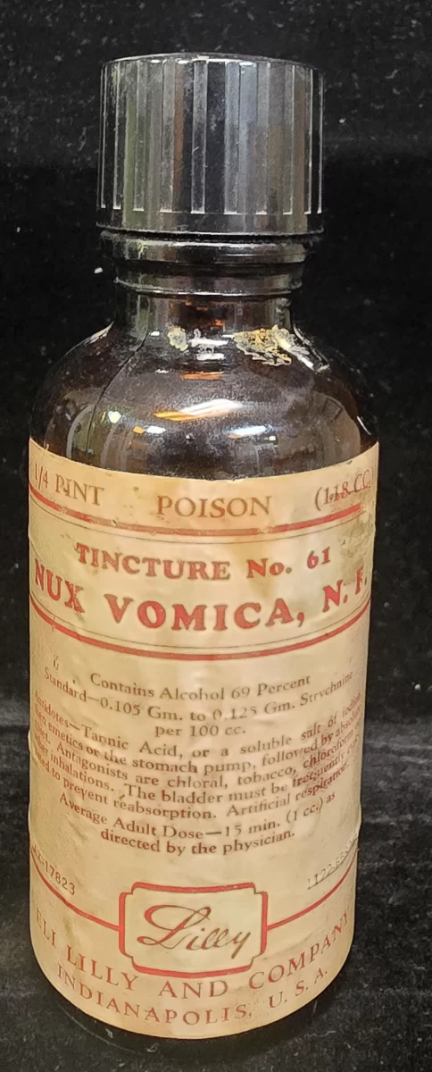 Eli Lilly Tincture of Nux Vomica poison bottle with strychnine label and antidote instructions