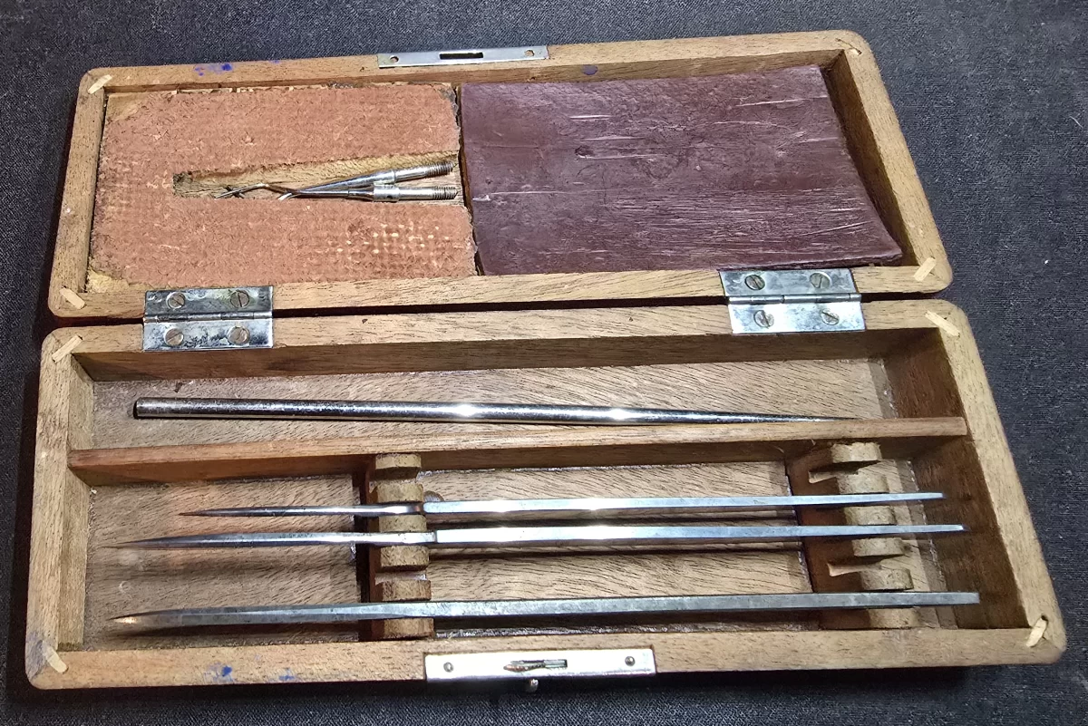 Antique Tiemann surgical instrument kit with scalpels and probes in fitted wooden case
